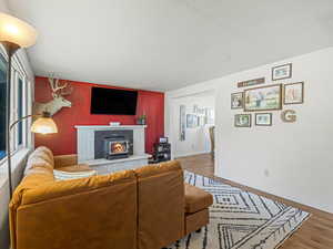 Living room with natural light and fireplace