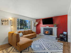 Living room with natural light and fireplace