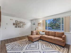Living room with natural light and fireplace