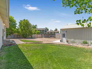 View of fenced backyard