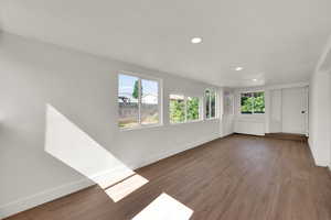 Spare room featuring wood finished floors and recessed lighting
