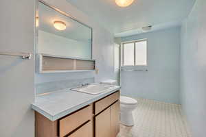 Bathroom featuring vanity and tile patterned floors