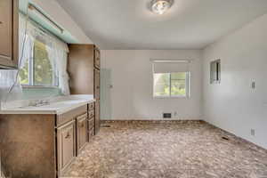 Bathroom with stone finish flooring and vanity