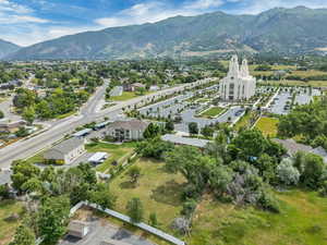 Aerial overview of property's location featuring a mountainous background