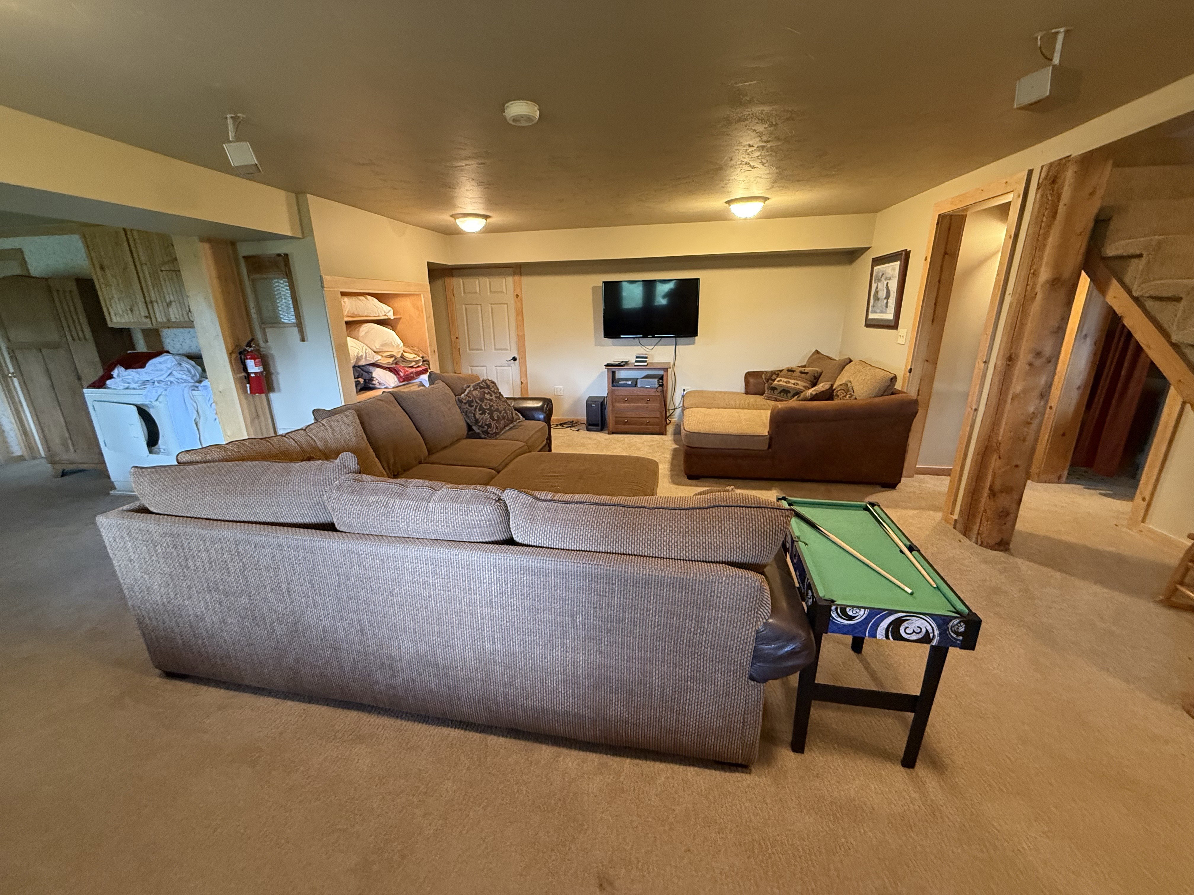 Living room with carpet and washer / clothes dryer