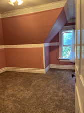 Bedroom #4 featuring sloped ceiling and window nook.