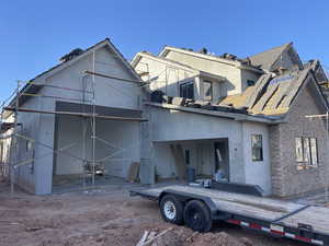 Back of property with stucco siding