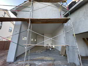 Exterior space featuring stucco siding