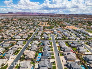 Aerial perspective of suburban area with a mountainous background