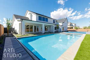 Rear view of property featuring a patio and stucco siding