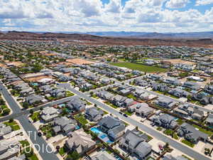 Aerial perspective of suburban area featuring a mountain backdrop