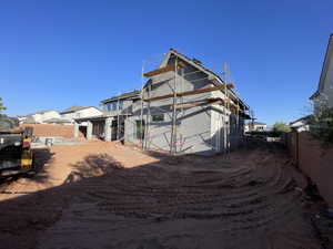 Back of property with a fenced backyard