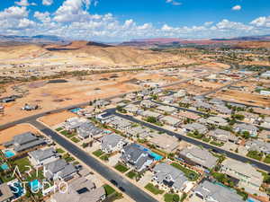 View of property location with mountains and nearby suburban area