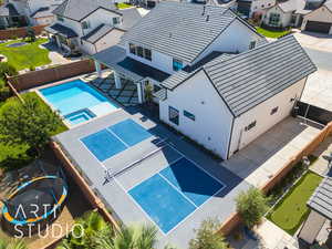 Aerial view of residential area featuring a pool