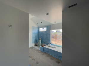 Bathroom with vaulted ceiling