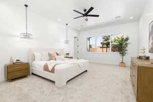 Bedroom with light carpet, recessed lighting, and a ceiling fan