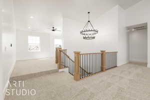 Hall featuring an upstairs landing, carpet flooring, recessed lighting, and a chandelier
