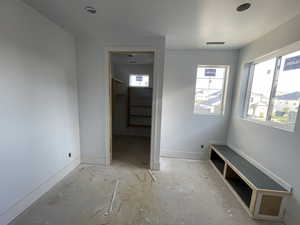 Unfurnished bedroom with baseboards