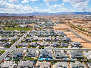 Aerial view of residential area featuring a mountain backdrop