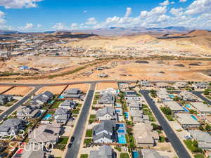 Aerial perspective of suburban area with a mountainous background
