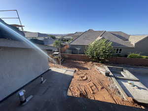 View of property exterior with a fenced backyard and a residential view
