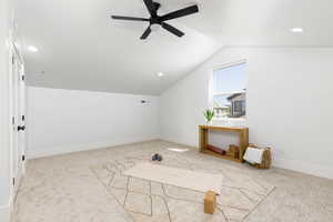 Bonus room featuring light colored carpet, recessed lighting, and ceiling fan