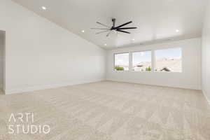 Empty room with recessed lighting, light carpet, a ceiling fan, and lofted ceiling