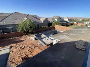 Exterior view of a fenced backyard and a residential view