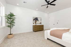 Bedroom with carpet flooring, a ceiling fan, and recessed lighting