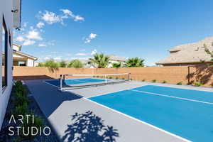 View of tennis court featuring a patio and basketball court