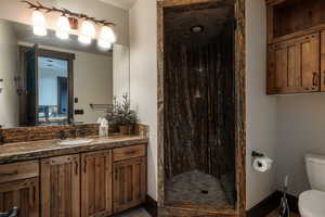 Full bathroom with vanity and a shower stall