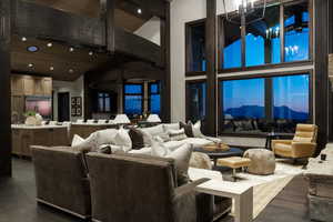 Common area featuring high vaulted ceiling, recessed lighting, and a wooden ceiling with exposed beams