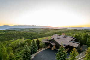 View of mountain backdrop with a heavily wooded area
