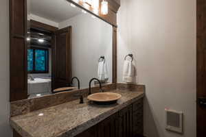 Ensuite bathroom featuring vanity and heating unit