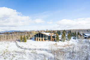 Snow covered house with a chimney