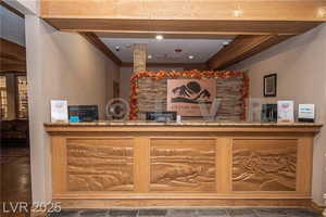 Reception area with ornamental molding and a bar