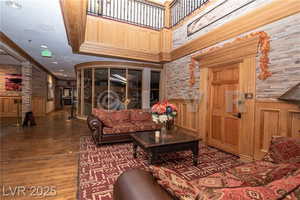 Lobby with a wainscoted wall, crown molding, and recessed lighting
