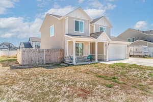 Craftsman inspired home with board and batten siding, driveway, an attached garage, a shingled roof, and a porch