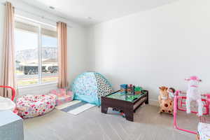 Game room featuring carpet floors and a mountain view