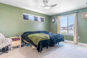 Bedroom featuring carpet flooring and a ceiling fan