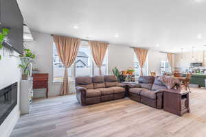 Living room featuring light wood-style floors and recessed lighting
