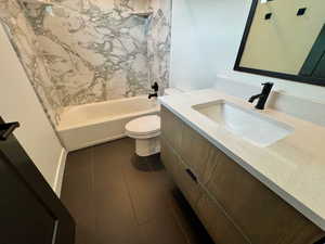Full bath with vanity, bathing tub / shower combination, and tile patterned floors