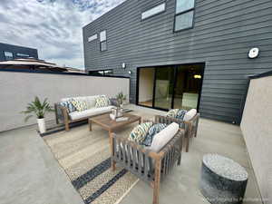 View of patio featuring an outdoor hangout area