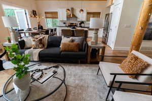 Living area with light wood-style floors and baseboards