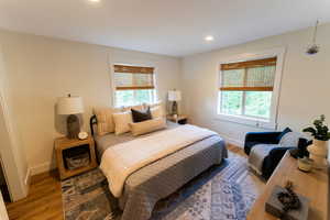 Bedroom featuring wood finished floors and recessed lighting