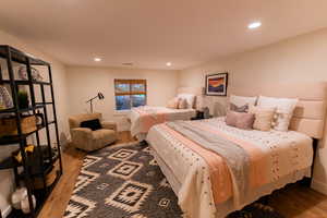 Bedroom featuring wood finished floors and recessed lighting