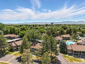 Bird's eye view of mountains and a pool area