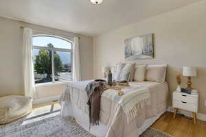 Bedroom with baseboards and light wood-style floors