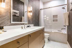 Full bathroom featuring vanity, shower / bath combo, and tile patterned floors