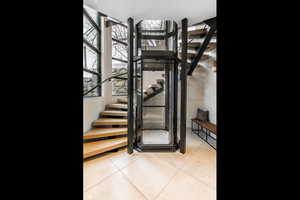 Stairway featuring tile patterned flooring